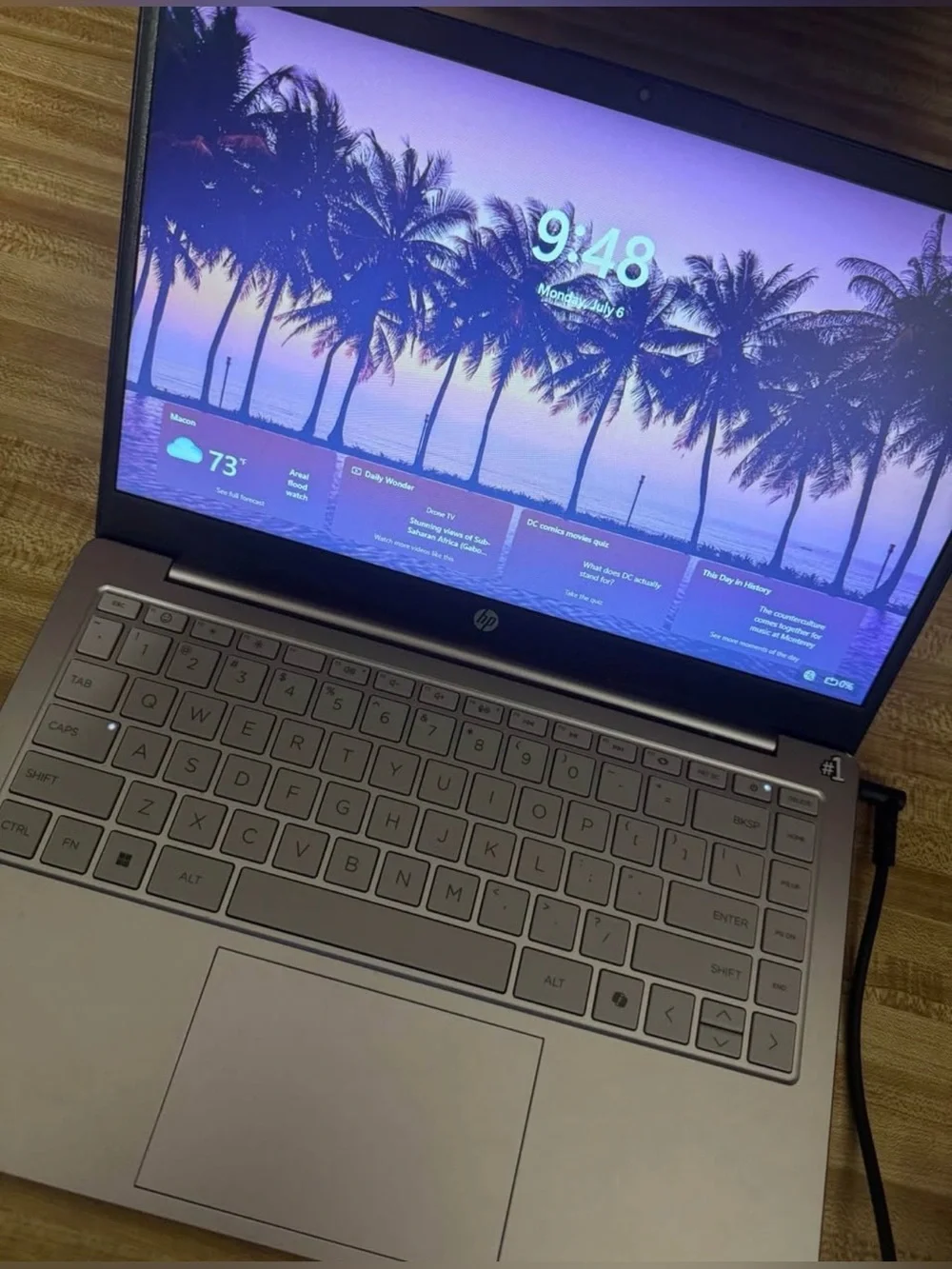 HP Silver Laptop with Purple Display Accent